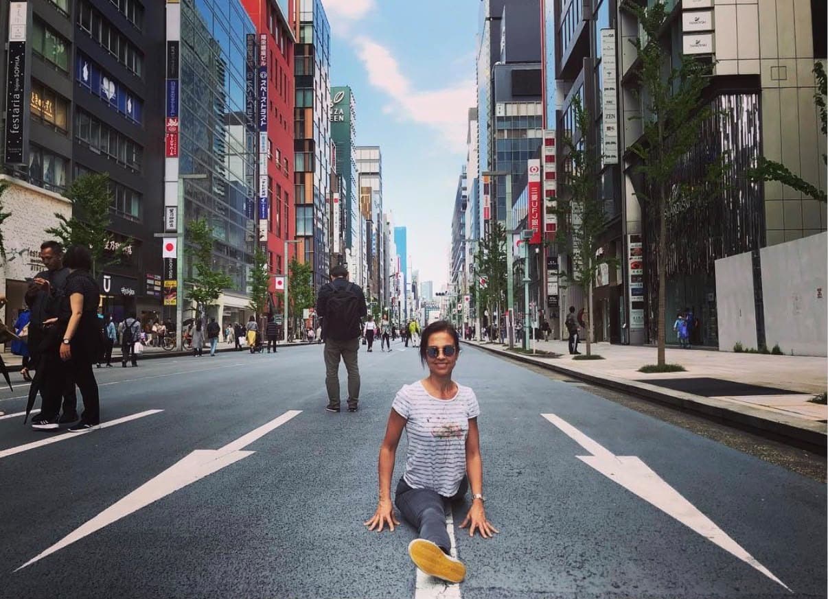 Tania in full splits on a closed street in Ginza, Tokyo